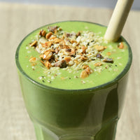 Glass full of green smoothie KIANO